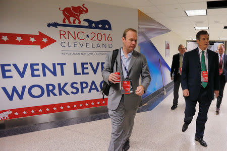 FILE PHOTO: Paul Manafort (R), campaign manager to Republican presidential candidate Donald Trump, and his assistant Rick Gates (L) walk through the halls of the Republican National Convention in Cleveland, Ohio, U.S. July 17, 2016. REUTERS/Brian Snyder/File Photo