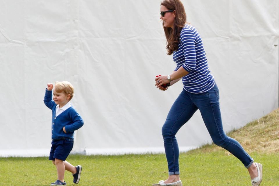 <p>Middleton chases after Prince George with toys in hand at a charity polo match in Tetbury, England.</p>