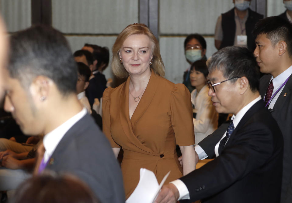 Former Britain's Prime Minister Liz Truss walks to deliver a speech on the second day of her five-day visit in Taipei, Taiwan, Wednesday, May 17, 2023. (AP Photo/ Chiang Ying-ying)