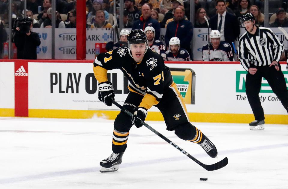 Mar 28, 2024; Pittsburgh, Pennsylvania, USA; Pittsburgh Penguins center Evgeni Malkin (71) moves the puck against the Columbus Blue Jackets during the first period at PPG Paints Arena. Mandatory Credit: Charles LeClaire-USA TODAY Sports