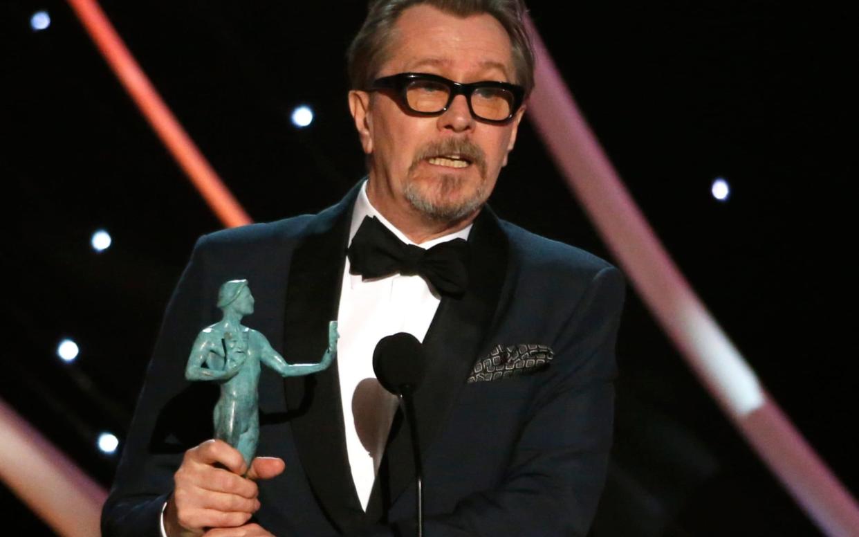 Gary Oldman accepting his SAG award in Los Angeles - REUTERS