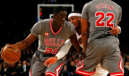 Dec 19, 2015; New York, NY, USA; Chicago Bulls forward Tony Snell (20) dribbles away from New York Knicks forward Carmelo Anthony (7) during second half at Madison Square Garden. The New York Knicks defeated the Chicago Bulls 107-91. Mandatory Credit: Noah K. Murray-USA TODAY Sports