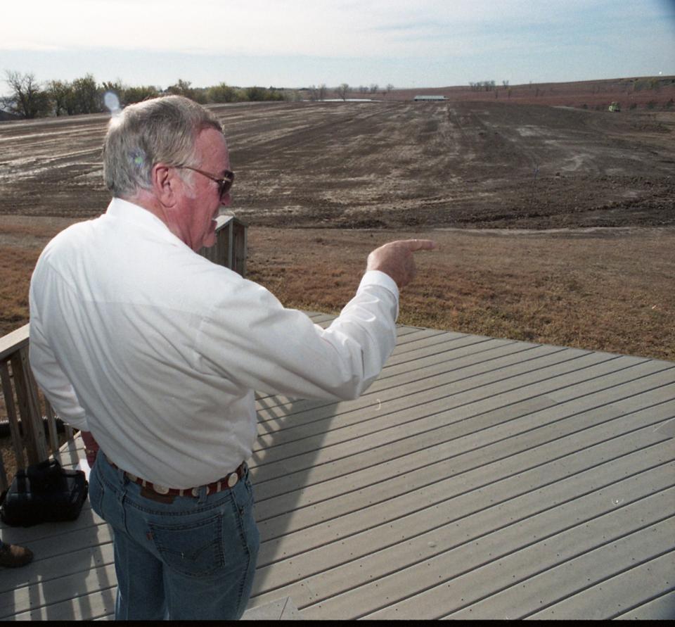 Charlie Walker, founding father of the Rolling Hills Zoo, points to the land where the Museum is currently at the Rolling Hill Zoo. [JOURNAL FILE PHOTO]