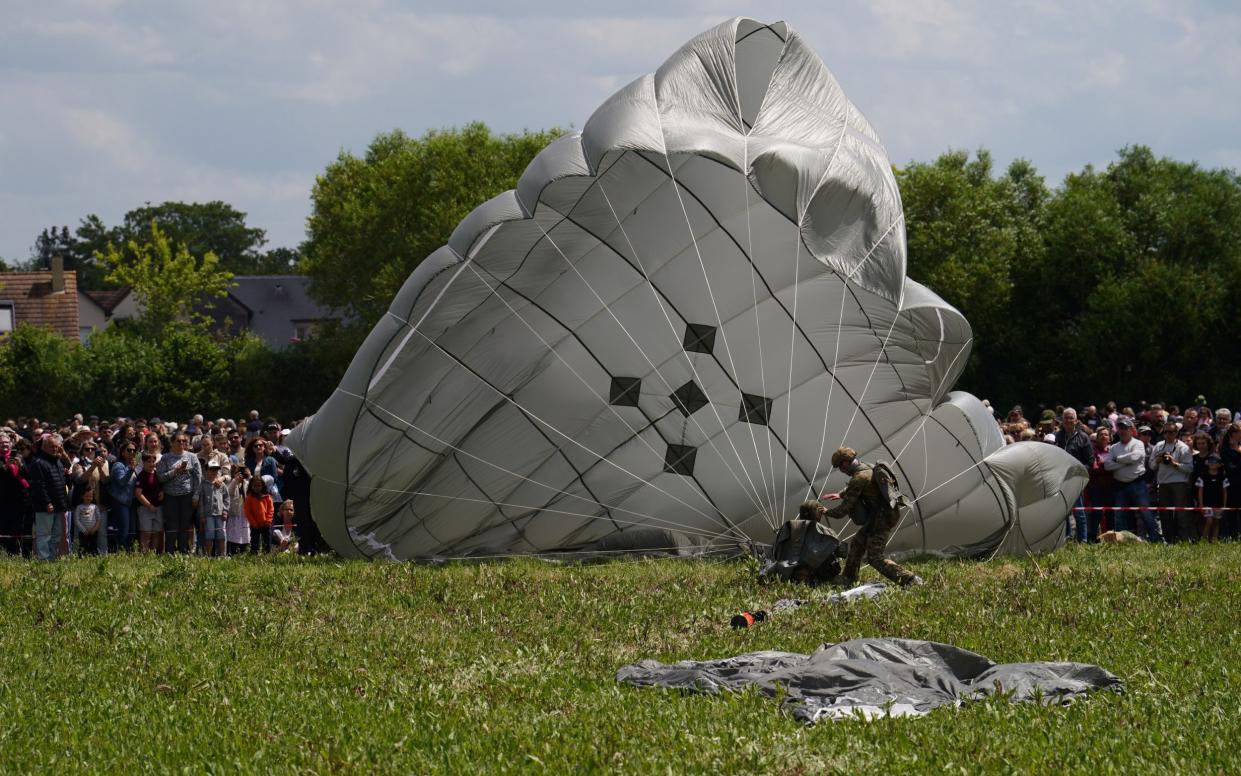 Parachute jumpers land in Normandy