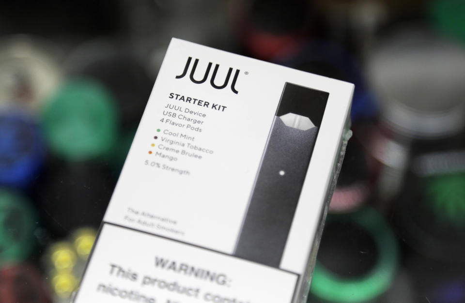 FILE - A Juul electronic cigarette starter kit is seen at a smoke shop on Dec. 20, 2018, in New York. Minnesota Attorney General Keith Ellison is slated to lead off opening statements expected for Tuesday, March 28, 2023, in his state's lawsuit against Juul Labs – marking the first time any of the thousands of cases against the e-cigarette maker over its alleged marketing to young people is going to play out in a courtroom. (AP Photo/Seth Wenig, File)