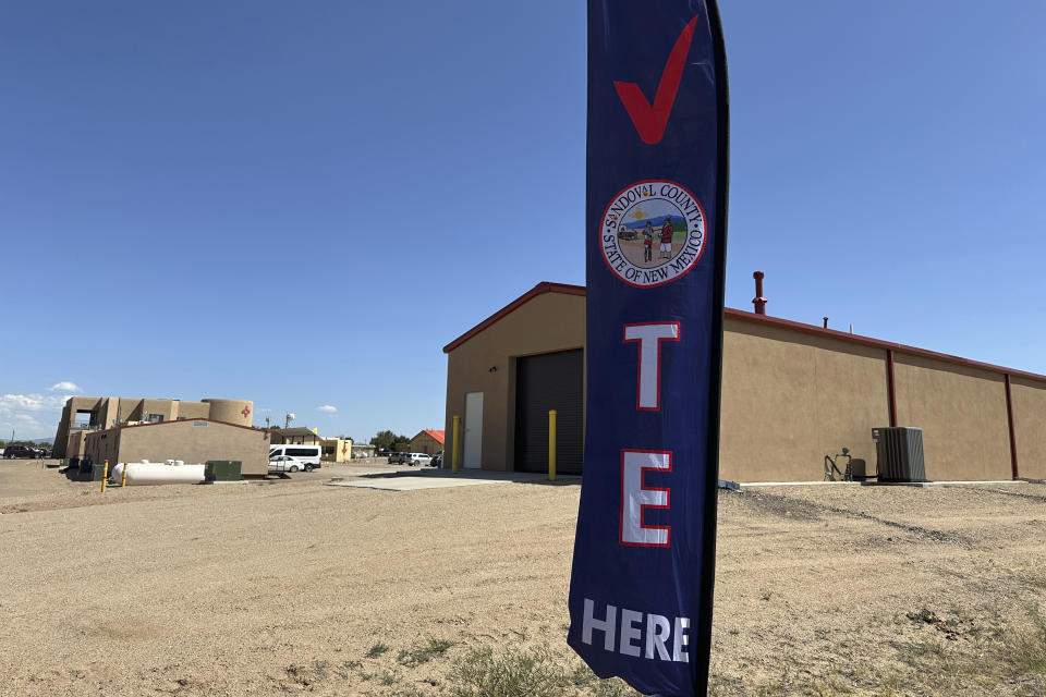 A banner directs voters to an early voting center at tribal headquarters at Zia Pueblo, New Mexico, on Wednesday, May 22, 2024. An act of Congress a century ago granted U.S. citizenship to Native Americans, marking the start of a long, arduous journey to secure voting rights. (AP Photo/Susan Montoya Bryan)