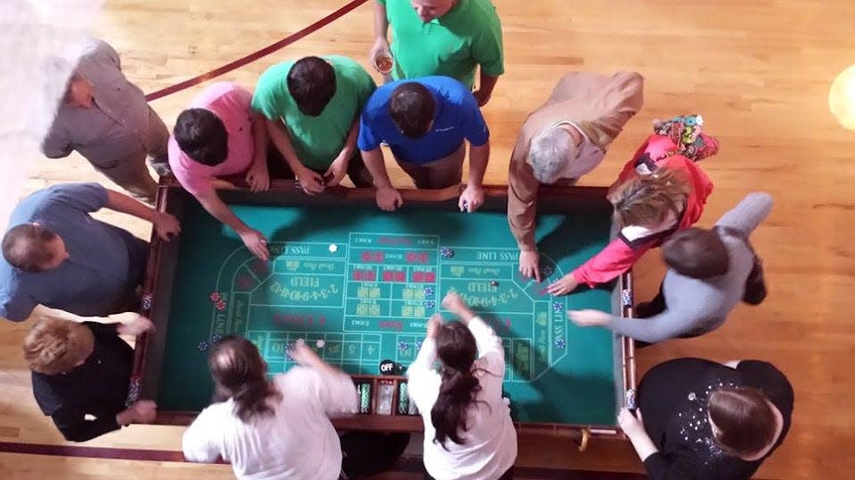 The craps table is a popular attraction at a fantasy casino party.