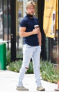 <p>Derek Hough leisurely waits outside for his Sweetgreen salad to be made on Tuesday.</p>