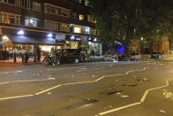 A view of the scene where protesters clashed with police outside the Kilburn Islamic Centre in London, Sunday, Sept. 25, 2022. They were protesting against the death of Iranian Mahsa Amini, a 22-year-old woman, who died in Iran while in police custody, was arrested by Iran's morality police for allegedly violating its strictly-enforced dress code. (David Parry/PA via AP)