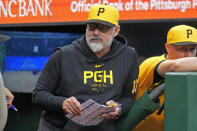 Pittsburgh Pirates' Derek Shelton stands on the dugout steps during the second inning of a baseball game against the Colorado Rockies in Pittsburgh, Friday, May 3, 2024. (AP Photo/Gene J. Puskar)