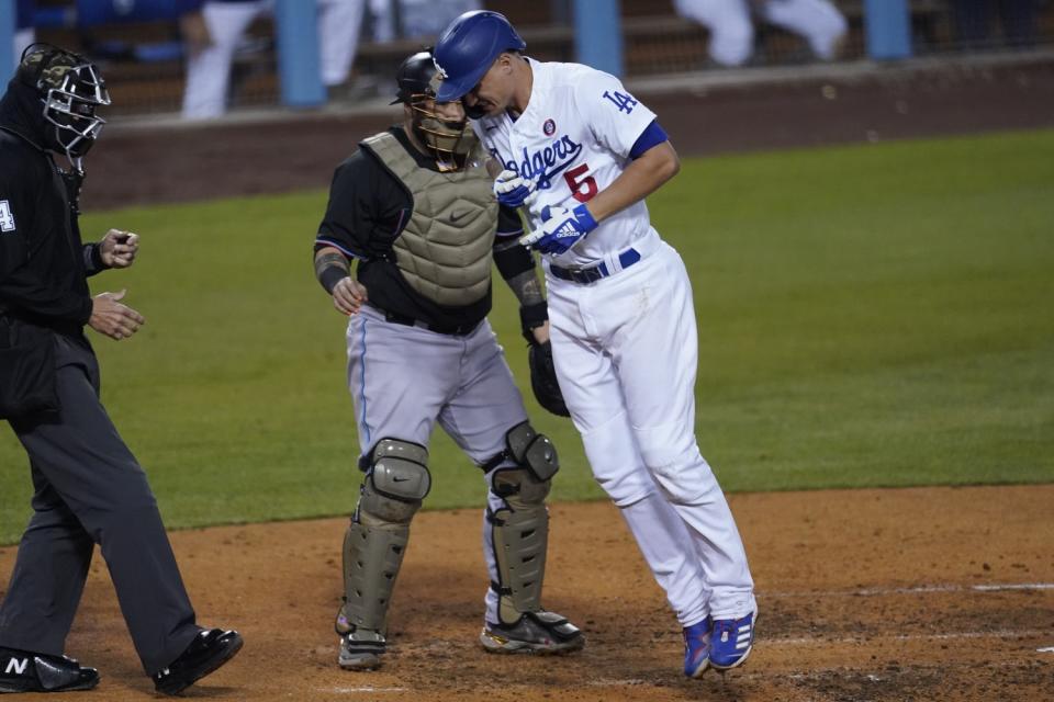 The Dodgers' Corey Seager reacts after being hit with a pitch by Miami Marlins reliever Ross Detwiler in the fifth inning.