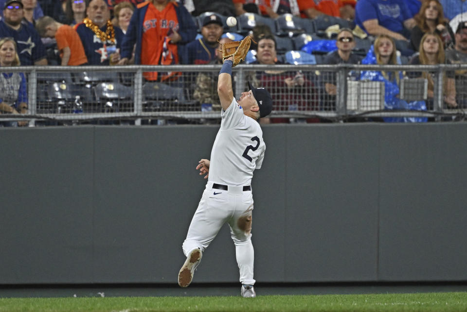 Houston Astros third baseman Alex Bregman catches a foul pop fly during the fifth inning of a baseball game against the Kansas City Royals, Saturday, Sept. 16, 2023, in Kansas City, Mo. (AP Photo/Peter Aiken)