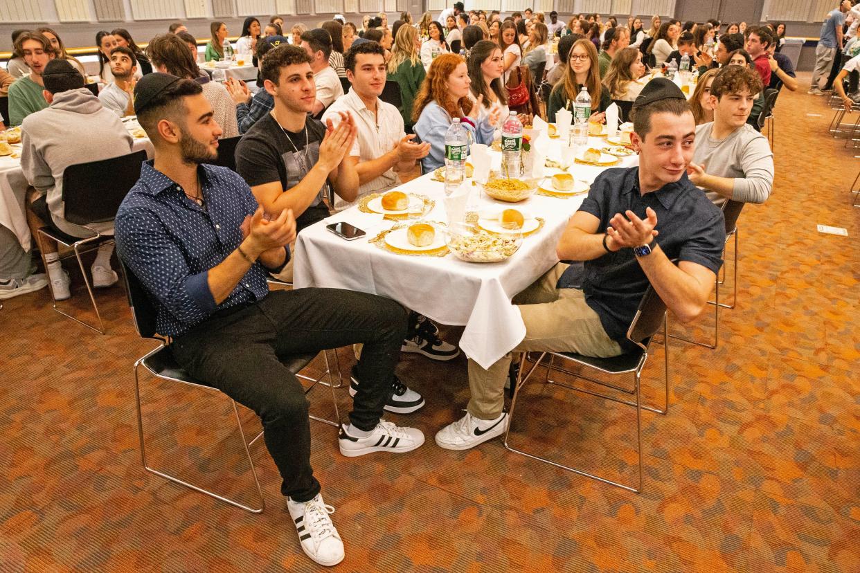 University of Delaware students applaud during the largest UD-hosted Mega Shabbat dinner, with 400 attendees and dozens waitlisted, at the Trabant University Center in Newark, Friday, Oct. 20, 2023.