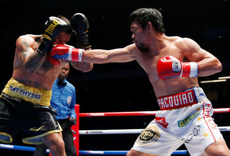 Boxing - WBA Welterweight Title Fight - Manny Pacquiao v Lucas Matthysse - Axiata Arena, Kuala Lumpur, Malaysia - July 15, 2018 Manny Pacquiao in action against Lucas Matthysse REUTERS/Lai Seng Sin