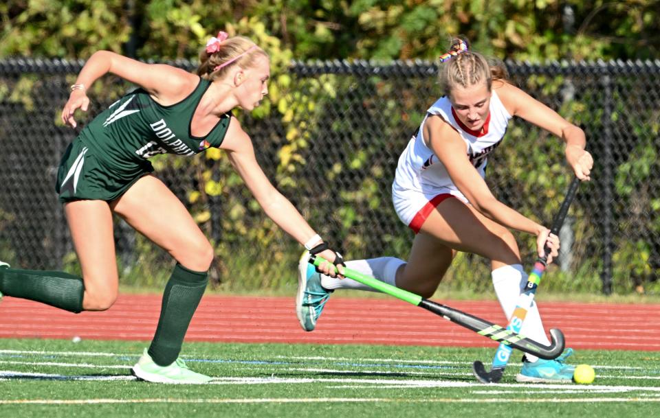 Leah Woodward of D-Y attempts to stop Chloe Egan of Barnstable.