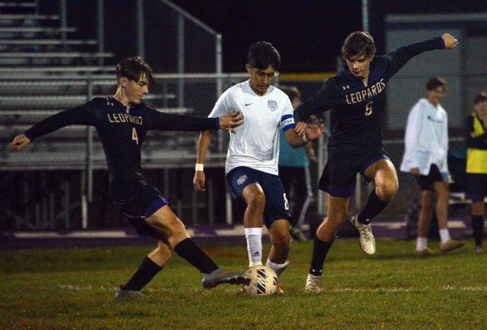 Smithsburg's Tyler Miller (4) and Liam Fisher (6) challenge Catoctin's Erick Lopez (8) during a Maryland Class 1A West Region II boys soccer quarterfinal at Smithsburg on Oct. 26, 2022. Miller scored both goals in the Leopards' 2-1 overtime victory.