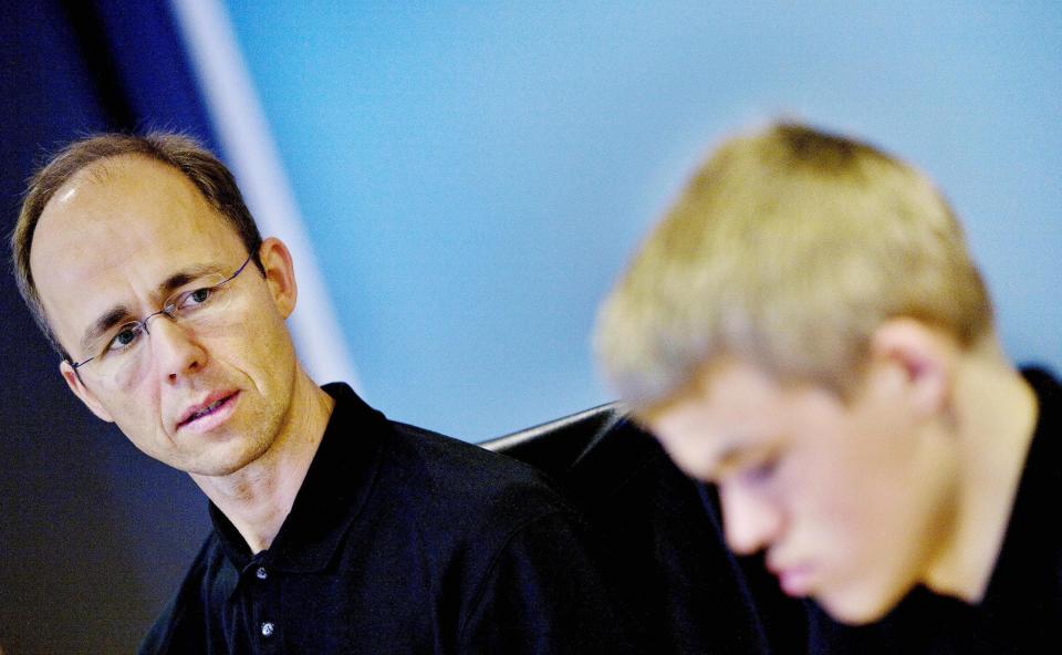 Henrik Carlsen looks at his son during a press conference in 2007.