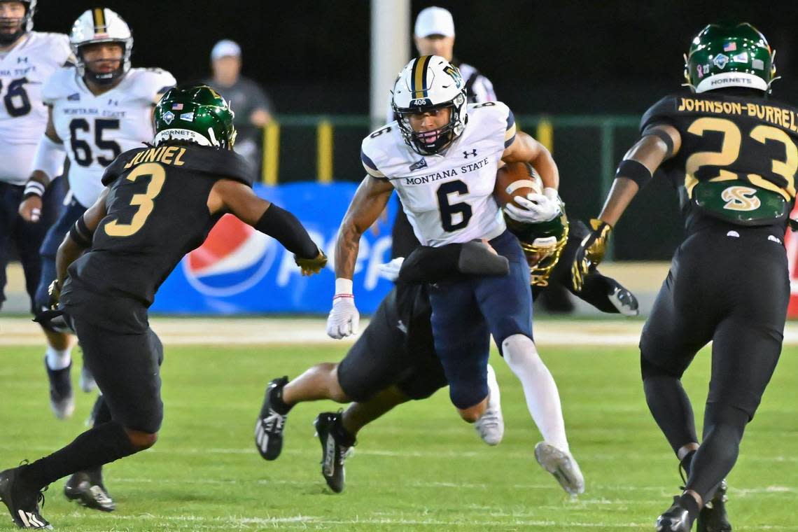 Montana State Bobcats wide receiver Ty McCullouch (6) runs the ball for a first down before being tackled by Sacramento State Hornets cornerback Darian Pollard (14) in the first half of the NCAA football game at Hornet Stadium on Saturday, Oct. 21, 2023. Sara Nevis/snevis@sacbee.com