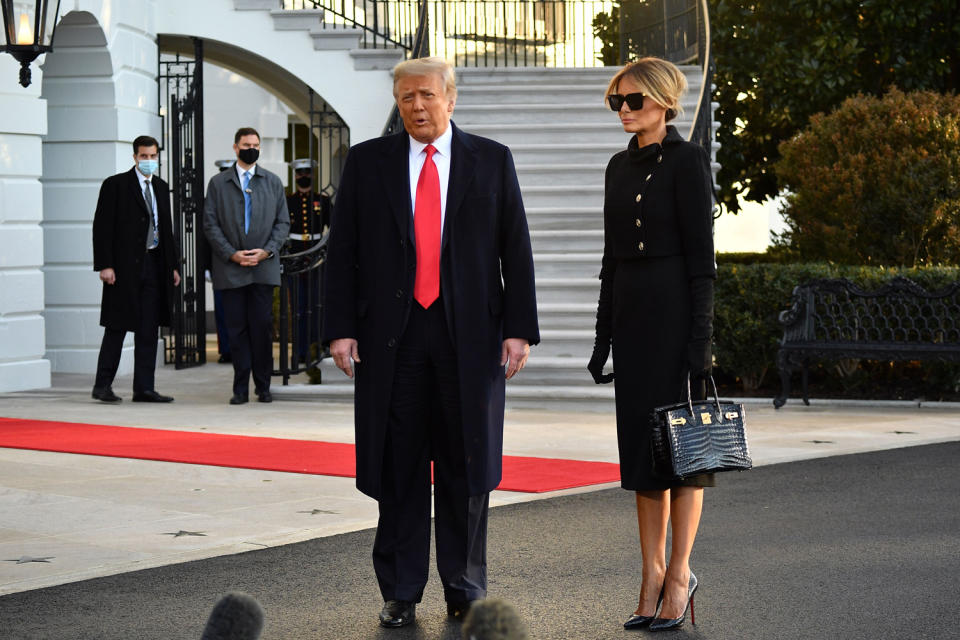 <p>Donald Trump and Melania Trump talk to the press as they depart the White House.</p>