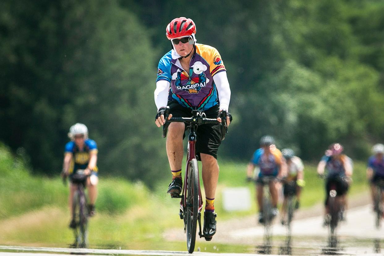 Heat radiates off of the pavement as riders near Mason City during the fourth day of RAGBRAI in 2022.