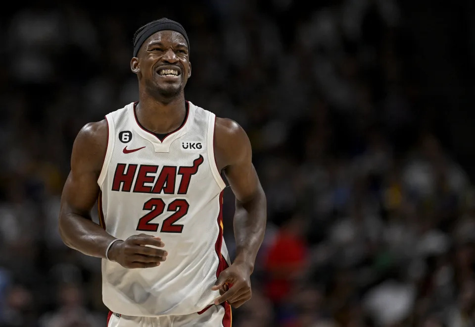 Miami Heat star Jimmy Butler winces after taking contact against the Denver Nuggets in the second quarter during Game 2 of the NBA Finals at Ball Arena in Denver on Sunday. (AAron Ontiveroz/The Denver Post)