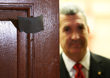 Bullet holes are pictured in the door to the room where the NDP holds caucus meetings on Parliament Hill in Ottawa October 23, 2014. REUTERS/Chris Wattie
