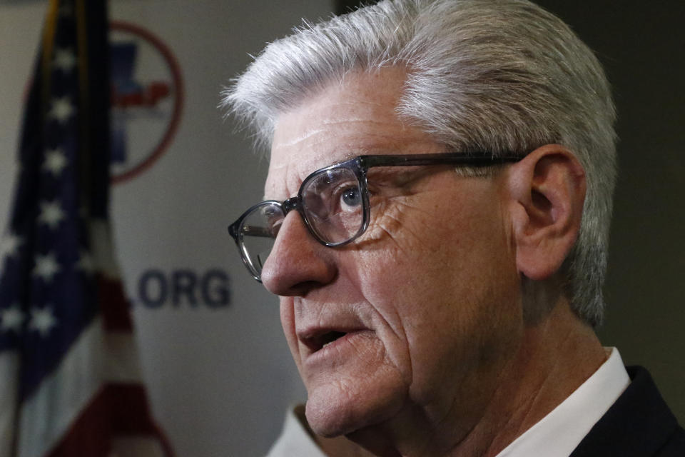 Gov. Phil Bryant discusses with reporters, his concerns about the recent violence at the state penitentiary in Parchman, Monday, Jan. 6, 2020, in Jackson, Miss. (AP Photo/Rogelio V. Solis)