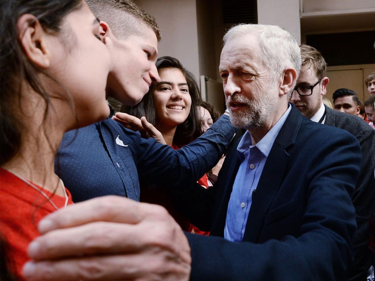 The new Labour leader is greeted by supporters (PA)