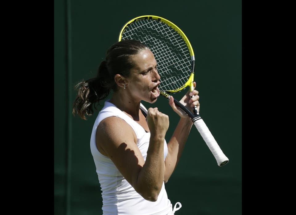 Roberta Vinci of Italy reacts after defeating Mirjana Lucic of Croatia during a third round women's singles match at the All England Lawn Tennis Championships at Wimbledon, England, Saturday, June 30, 2012.