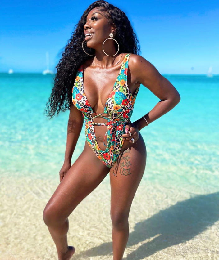 <p>The <em>Real Housewives of Potomac</em> star managed to make time for a "baecation" with her hubby during their <a href="https://www.instagram.com/p/CYPWVmrvVZm/" rel="nofollow noopener" target="_blank" data-ylk="slk:family getaway" class="link ">family getaway</a> — and wore a tropical-print low-cut suit for the occasion. </p>