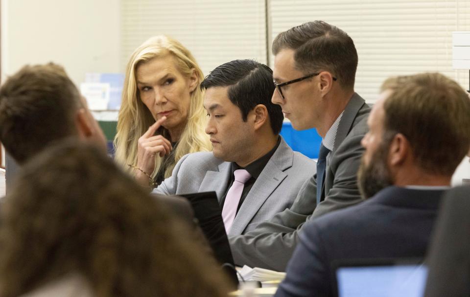 Defense attorney Casey Arbenz, defense attorney Anne Bremner, Tacoma Police officer Timothy Rankine, defense attorney Mark Conrad and Tacoma Police officer Matthew Collins watch still images from a video on a computer of the arrest of Manny Ellis during the trial of Collins, Rankine and Tacoma Police officer Christopher Burbank.