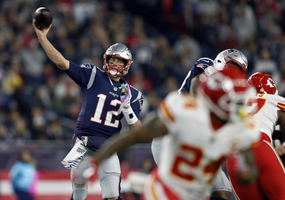 New England Patriots quarterback Tom Brady (12) passes under pressure from the Kansas City Chiefs. (AP Photo/Michael Dwyer)