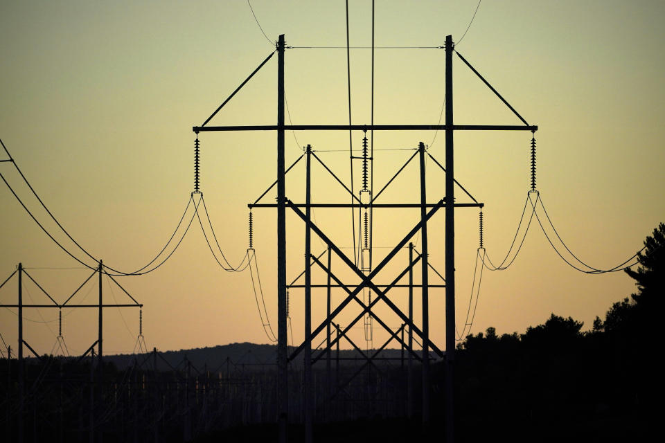 FILE - Central Maine Power utility lines are seen on Oct. 6, 2021, in Pownal, Maine. Extremist groups in the United States appear to increasingly view attacking the power grid as a means of disrupting the country, according to a government report aimed at law enforcement agencies and utility operators. (AP Photo/Robert F. Bukaty, File)