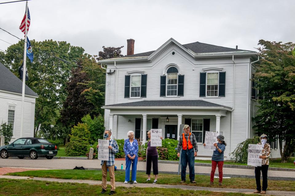 Several people gathered outside York Town Hall on Friday, Sept. 24, 2021, to protest a proposal to build a cell antenna array atop the Roots Rock Road water tower, citing known and unknown health and safety concerns about the project.