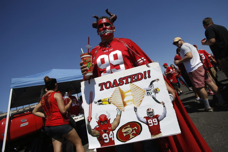 A fan holds a sign 49ers plays Packers in San Francisco