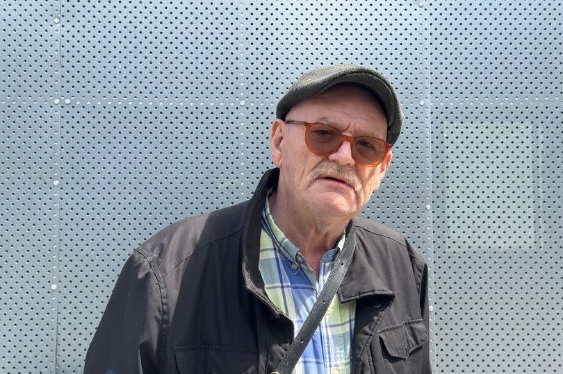 Dave Hardman-Bennett, 64, wearing a hat and glasses