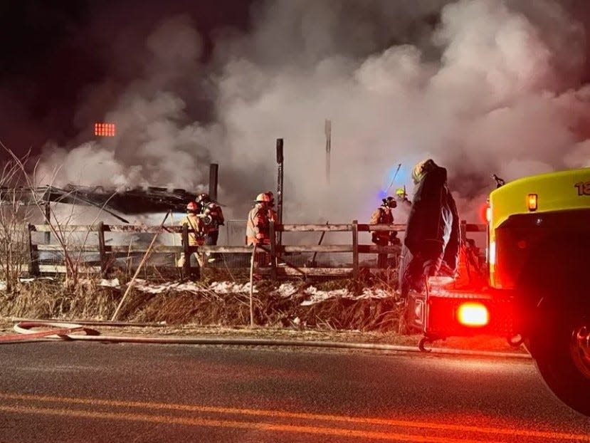 Firefighters battle a blaze in Wright Township early Wednesday, Feb. 8, 2023.