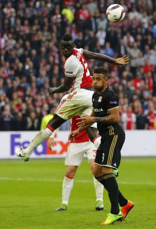 Football Soccer - Ajax Amsterdam v Olympique Lyonnais - UEFA Europa League Semi Final First Leg - Amsterdam ArenA, Amsterdam, Netherlands - 3/5/17 Ajax's Bertrand Traore in action with Lyon's Corentin Tolisso Reuters / Michael Kooren Livepic