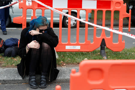 People gather to pay respects after Friday's shooting, outside the Masjid Al Noor in Christchurch, New Zealand March 18, 2019. REUTERS/Jorge Silva