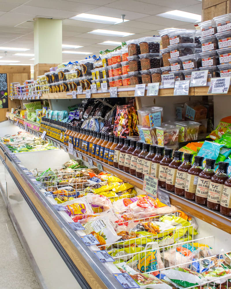 Los Angeles, California, United States - 04-03-2019: A view of the frozen food section at Trader Joe's, with a shopper looking at products.