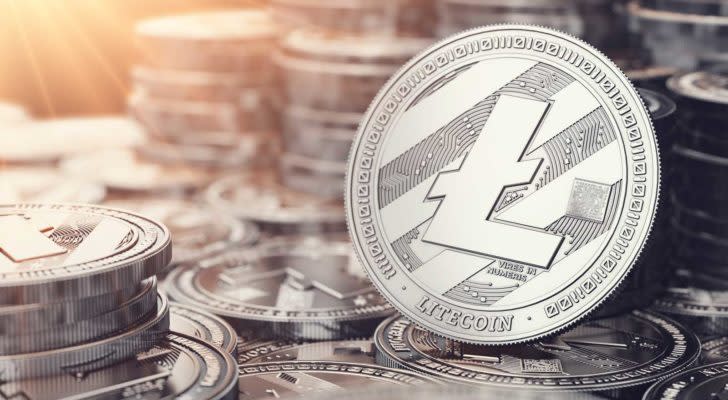 Image of one litecoin in front of many stacks of litecoins. Litecoin price predictions