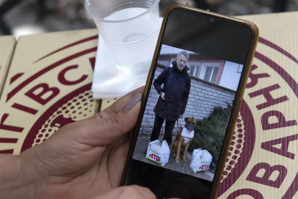 Olena, wife of Serhii Tsyhipa, a blogger, activist and military veteran, shows an image of him on her phone during an interview with The Associated Press in Kyiv, Ukraine, Aug. 22, 2022. He vanished March 12 and reappeared six weeks later on pro-Russian television, thin and hollow-eyed, regurgitating Russian propaganda. Ukrainian police analyzed the video and told AP he was clearly under duress. (AP Photo/Andrew Kravchenko)