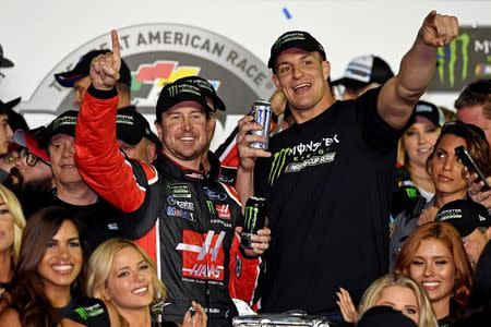 Feb 26, 2017; Daytona Beach, FL, USA; NASCAR Cup Series driver Kurt Busch (41) celebrates with New England Patriots tight end Rob Gronkowski after winning the 2017 Daytona 500 at Daytona International Speedway. Jasen Vinlove-USA TODAY Sports