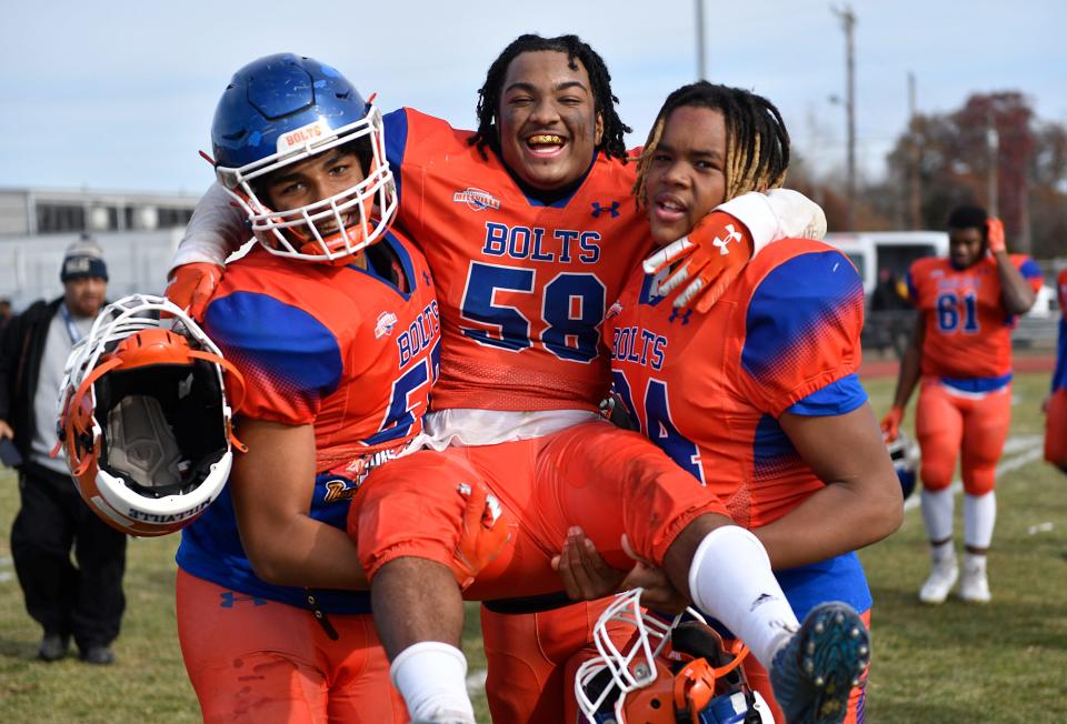 Millville's George Gonzales (58) is carried off the field following a 47-0 win over visiting Vineland on Thanksgiving Day. Nov. 25, 2021.