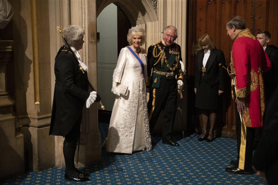 FILE - In this Monday, Oct. 14, 2019 file photo, Britain's Prince Charles, third left, and his wife Camilla the Duchess of Cornwall, second left, arrive in the Norman Porch, flanked at left by Black Rod, Sarah Clarke the first ever female to serve in the role of Black Rod, at the Palace of Westminster and the Houses of Parliament for the State Opening of Parliament ceremony in London. Prince Philip was the longest serving royal consort in British history. In Britain, the husband or wife of the monarch is known as consort, a position that carries immense prestige but has no constitutional role. The wife of King George VI, who outlived him by 50 years, was loved as the Queen Mother. Prince Charles’ wife, Camilla, has worked to emerge from the shadow of his immensely popular first wife, Diana. (AP Photo/Matt Dunham, Pool, File)