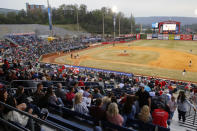 FILE - In this April 4, 2019, file photo, fans watch the Chattanooga Lookouts play the Montgomery Biscuits at AT&T Field in Chattanooga, Tenn. Major League Baseball is pushing a proposal to whack 42 teams _ and several entire leagues _ from its vast network of minor-league affiliates that bring the game to every corner of country. That includes Chattanooga, Tennessee, home of the Double-A Lookouts and a city where professional baseball was first played in 1885. (C.B. Schmelter/Chattanooga Times Free Press via AP, File)