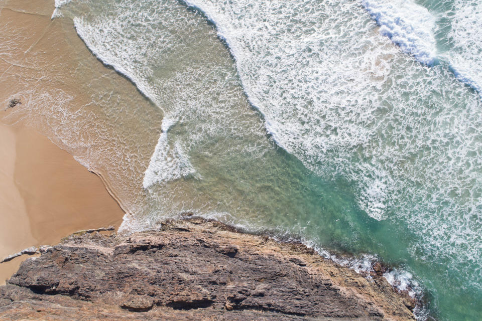 A secret cove with waves hitting the shore