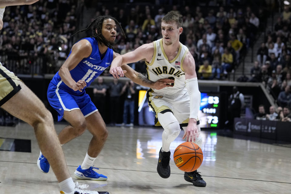 Purdue guard Braden Smith (3) drives on Hofstra guard Jaquan Carlos (11) during the second half of an NCAA college basketball game in West Lafayette, Ind., Wednesday, Dec. 7, 2022. (AP Photo/Michael Conroy)