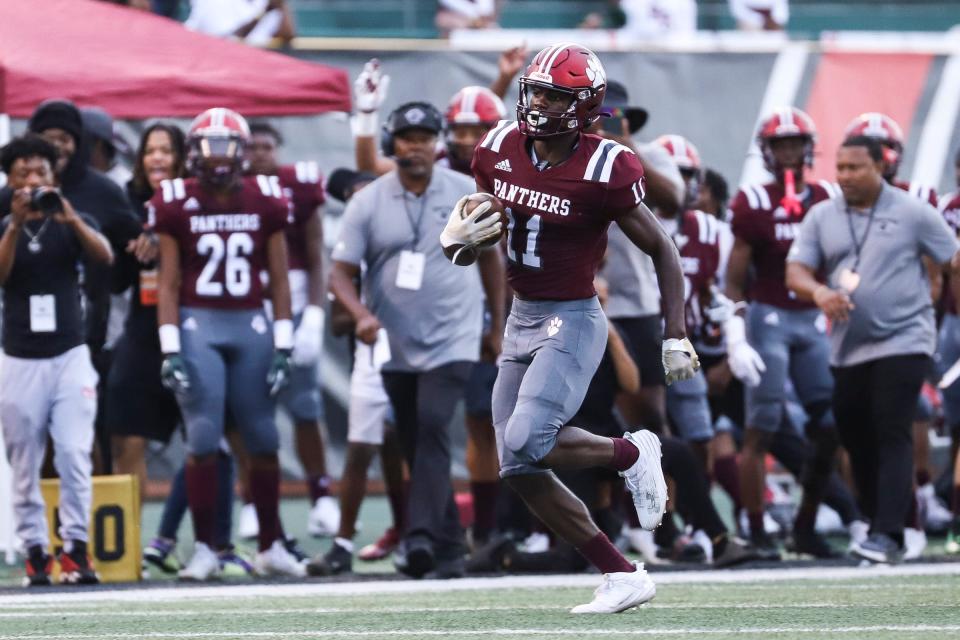 River Rouge wide receiver Nicholas Marsh (11) runs against Belleville after a fake punt during the first half of Prep Kickoff Classic at Wayne State University's Tom Adams Field in Detroi on Friday, August 25, 2023.