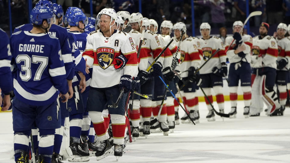 Florida Panthers right wing Patric Hornqvist (70) leads the team to congratulate the Tampa Bay Lightning after the Lightning defeated the Florida Panthers during Game 6 of an NHL hockey Stanley Cup first-round playoff series Wednesday, May 26, 2021, in Tampa, Fla. The Lightning won the series 4-2. (AP Photo/Chris O'Meara)